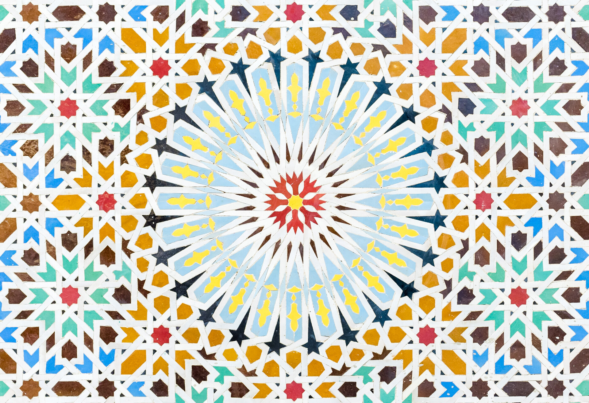 Zelige multi-coloured geometric mosaic of tiles in a typical arabic style. Found on the walls of a fountain at a mosque in the United Arab Emirates